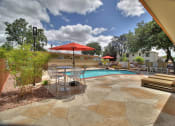 Thumbnail 22 of 38 - Poolside Dining Tables at 720 North Apartments, California