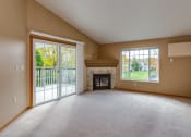 Thumbnail 13 of 38 - Spacious Living Area with Fireplace and Balcony