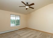 Thumbnail 38 of 38 - Spacious Bedroom with Ceiling Fan and Large Window