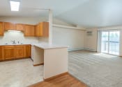 Thumbnail 36 of 38 - Kitchen with Open Concept Living Area with A/C Unit and Balcony