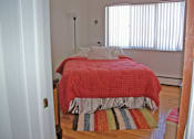 Thumbnail 1 of 5 - Bedroom at Woodruff House Apartments in Lansing, MI