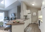 Thumbnail 2 of 53 - Kitchen and dining at Aspen Lakes in Holt, MI