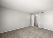 Thumbnail 19 of 24 - living room with carpet and a door to a hallway