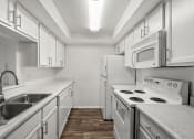 Thumbnail 14 of 24 - apartment kitchen with white appliances