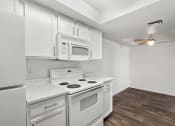 Thumbnail 16 of 24 - kitchen with white appliances and a ceiling fan