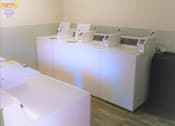 Thumbnail 27 of 46 - Communal Laundry Room