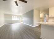 Thumbnail 4 of 46 - Living room, ceiling fan, and counter