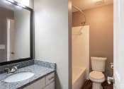Thumbnail 8 of 16 - Bathroom wth granite counters and large vanity