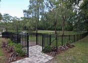 Thumbnail 16 of 16 - Fenced in courtyard area overlooking pond
