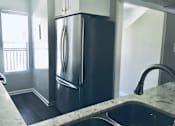 Thumbnail 23 of 45 - Diwhwasher, Fridge In Kitchen at Wilbur Oaks Apartments, Thousand Oaks, California