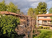Thumbnail 5 of 45 - Property View With Mature Tree at Wilbur Oaks Apartments, Thousand Oaks