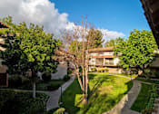 Thumbnail 6 of 45 - Property View With Mature Tree, cloud in sky at Wilbur Oaks Apartments, California, 91360