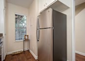 Thumbnail 35 of 45 - Fridge In Kitchen at Wilbur Oaks Apartments, California, 91360