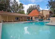 Thumbnail 2 of 40 - Swimming Pool And Relaxing Area at St. Charles Oaks Apartments, Thousand Oaks, CA
