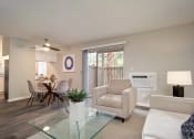 Thumbnail 31 of 40 - Sofa, Dinning Table in Living Room at St. Charles Oaks Apartments, California