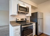 Thumbnail 24 of 40 - Eat-In Kitchen at St. Charles Oaks Apartments, Thousand Oaks, California