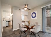 Thumbnail 23 of 40 - Ceiling Fan, Dinning Table in Living Room at St. Charles Oaks Apartments, Thousand Oaks, CA