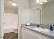 Thumbnail 5 of 40 - Western Toilet, Shower In Bathroom at St. Charles Oaks Apartments, Thousand Oaks, California
