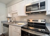 Thumbnail 4 of 40 - Fully Furnished Kitchen at St. Charles Oaks Apartments, Thousand Oaks