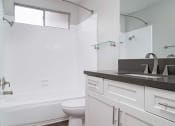 Thumbnail 33 of 67 - Tub, Toilet In Bathroom at Los Robles Apartments, Pasadena, California