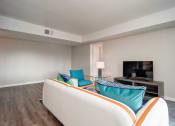 Thumbnail 40 of 67 - TV, White Sofa In Living Room at Los Robles Apartments, Pasadena, California