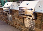 Thumbnail 15 of 23 - Outdoor BBQ Grill Area for Residents and Guests at 80501 Apartments