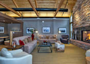 Thumbnail 18 of 23 - Resident Clubhouse Lounge and Media Room with Fireplace Near Downtown Denver Apartment