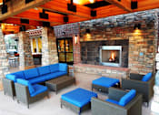 Thumbnail 14 of 23 - Beautiful Outdoor Lounge with Couches & Fireplace at Longmont CO Apartment Near Boulder