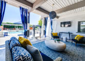 Thumbnail 8 of 21 - Outdoor lounge area with TV and seating near pool at Aliso Creek, Aliso Viejo, CA, 92656