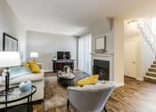 Thumbnail 16 of 21 - Living area with fireplace and TV at Aliso Creek, Aliso Viejo, CA