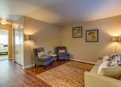 Thumbnail 16 of 31 - Living room with table and couch at Commons at Hawthorn Village Apartments, Hillsboro, OR, 97124