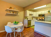 Thumbnail 12 of 31 - Dining table and chair at Commons at Hawthorn Village Apartments, Hillsboro, Oregon
