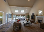 Thumbnail 6 of 30 - Living with couch and table at Commons at Creekside Apartments, Oregon