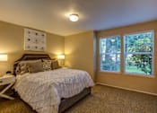 Thumbnail 20 of 30 - Bedroom with cozy bed at Commons at Creekside Apartments, Hillsboro, 97123