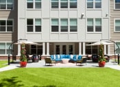 Thumbnail 10 of 24 - Elegant outdoor patio with comfortable seating arrangements