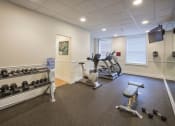 Thumbnail 10 of 13 - Gym with treadmills and other exercise equipment at Willett Apartments, Albany