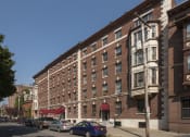 Thumbnail 1 of 13 - Building with balconies and a sidewalk at Willett Apartments, Albany, NY