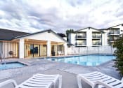 Thumbnail 11 of 14 - Westridge Apartments for rent in Clarkston, WA pool and white pool furniture