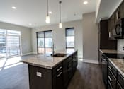 Thumbnail 18 of 45 - Luxury Kitchen Space with a View at Gateway at Belknap Apartments
