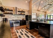 Thumbnail 20 of 65 - Clubhouse With Gourmet Kitchen at Aviator at Brooks Apartments, Clear Property Management, San Antonio, 78235