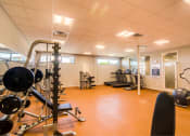 Thumbnail 17 of 65 - Clubhouse Gym with Free Weights at Aviator at Brooks Apartments, San Antonio, 78235