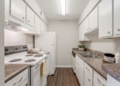 Thumbnail 6 of 15 - Galley style kitchen  at Forest Gardens, Dallas, TX, 75243 