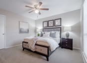 Thumbnail 9 of 13 - Large bedroom with ceiling fan  at Country Square, Carrollton, TX