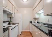 Thumbnail 5 of 11 - Fully equipped kitchen at Garden Park, Irving, 75062