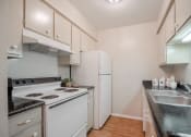 Thumbnail 6 of 11 - Plank floor and stainless steel double sink  at Garden Park, Irving, TX