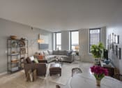 Thumbnail 14 of 39 - Model Living Area with views of downtown from windows at The Equitable Building, Des Moines