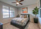 Thumbnail 31 of 78 - bedroom with ceiling fan and window view  at EdgeWater at City Center, Kansas, 66219