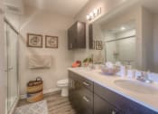 Thumbnail 33 of 78 - bathroom with dual sinks and walk in shower  at EdgeWater at City Center, Lenexa, KS, 66219