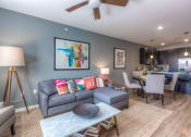 Thumbnail 72 of 78 - living room with couch and ceiling fan and dining room table  at EdgeWater at City Center, Lenexa, 66219