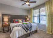Thumbnail 75 of 78 - Bedroom with large bed and ceiling fan  at EdgeWater at City Center, Kansas, 66219